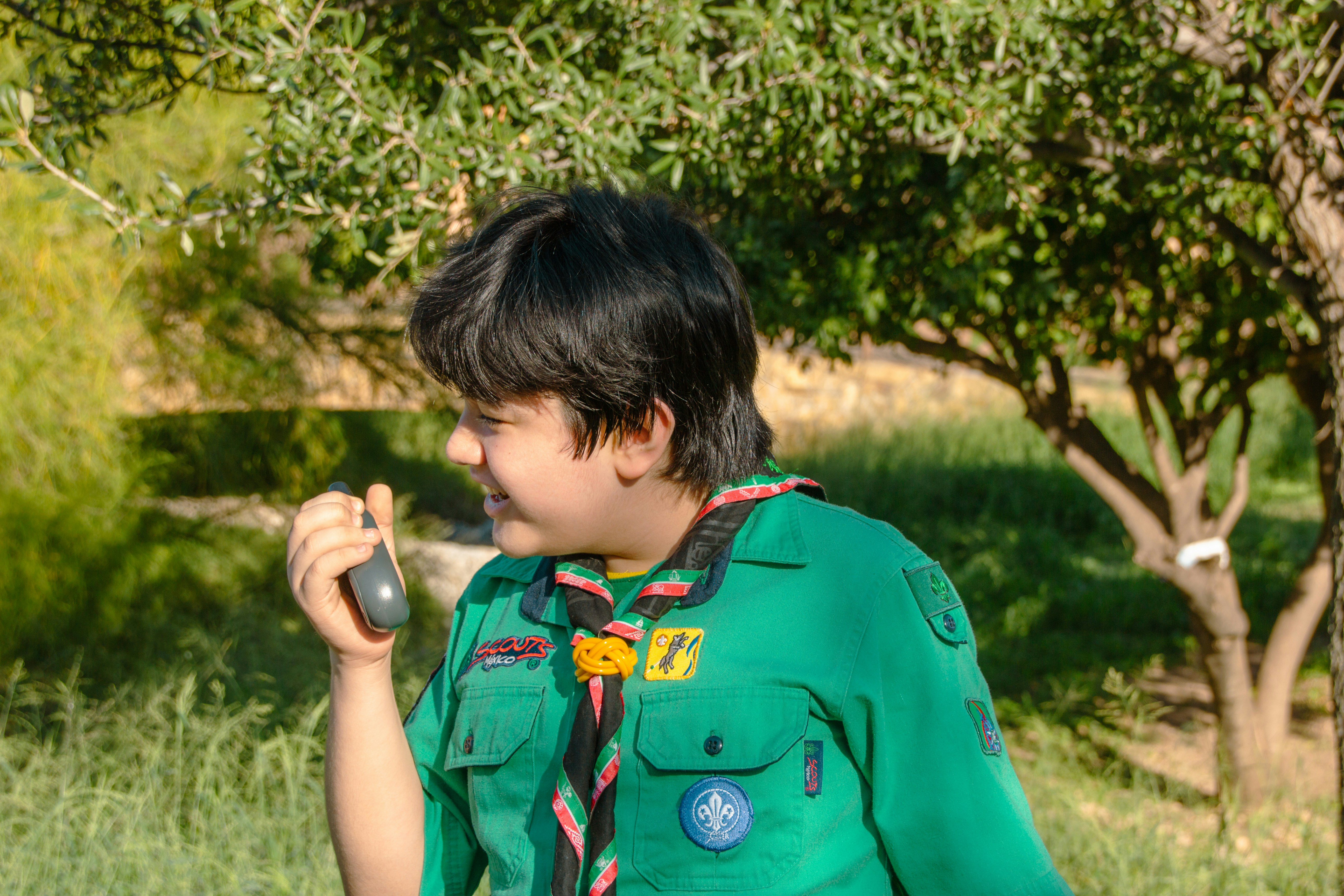 Photo of a boy scout in sunny nature